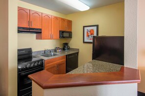 Full-size fridge, microwave, stovetop, dishwasher