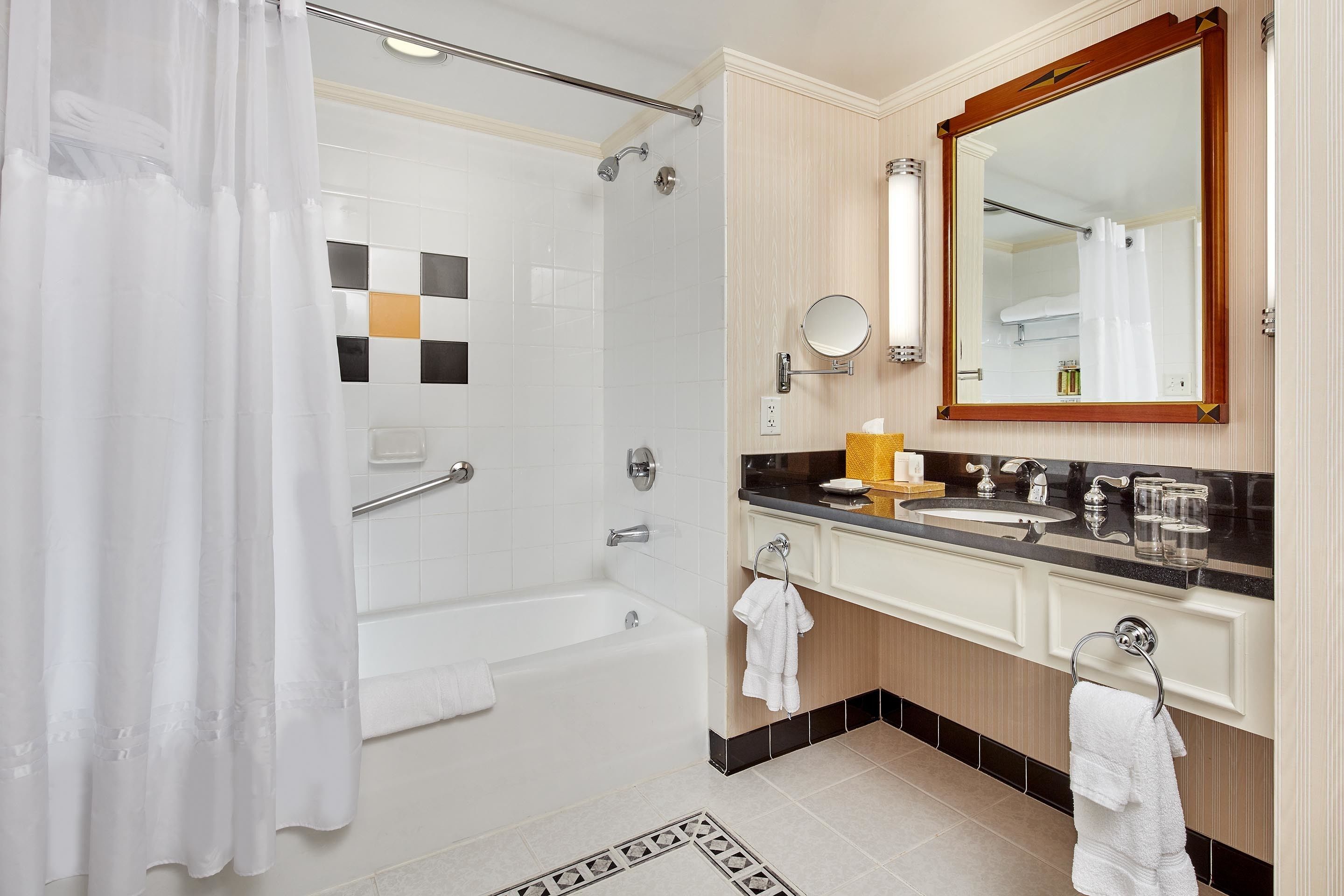 combined shower/bathtub, designer toiletries, hair dryer, bathrobes