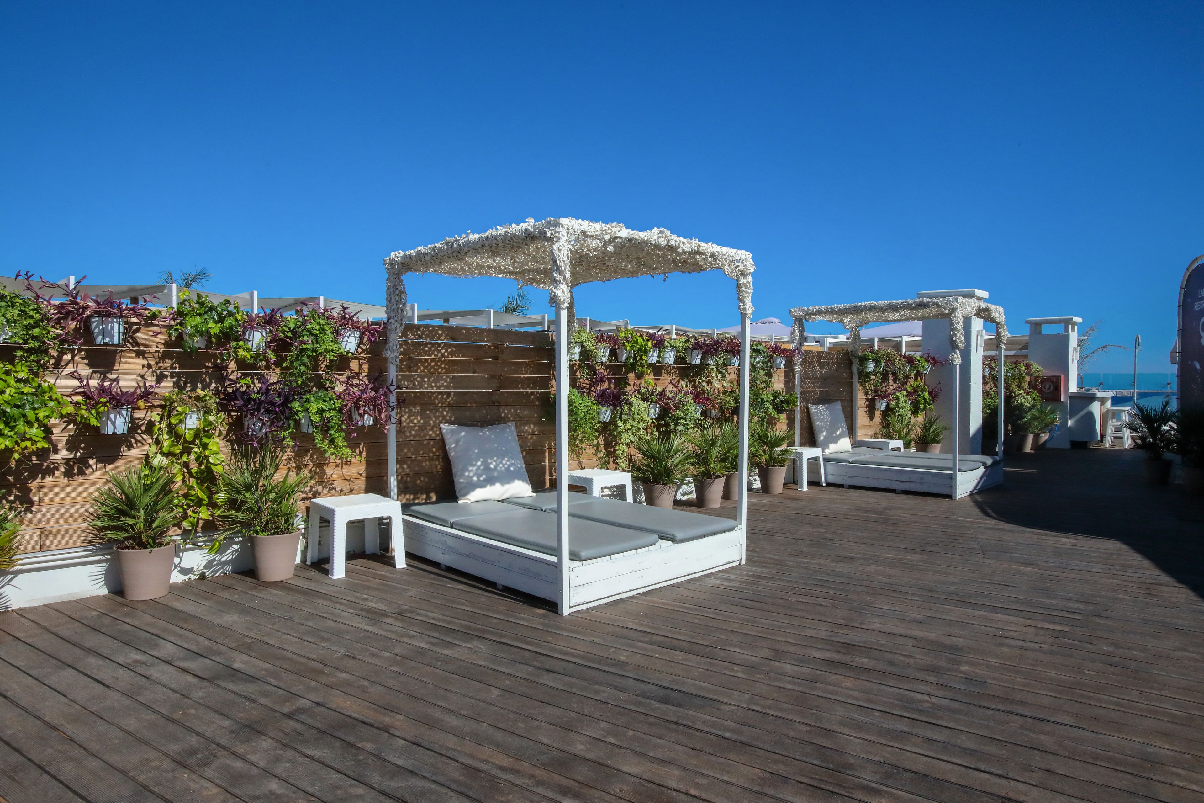 Seasonal outdoor pool, open 11:00 AM to 8:00 PM, pool umbrellas