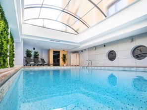 Indoor pool, open 9:00 AM to 10:00 PM, pool loungers