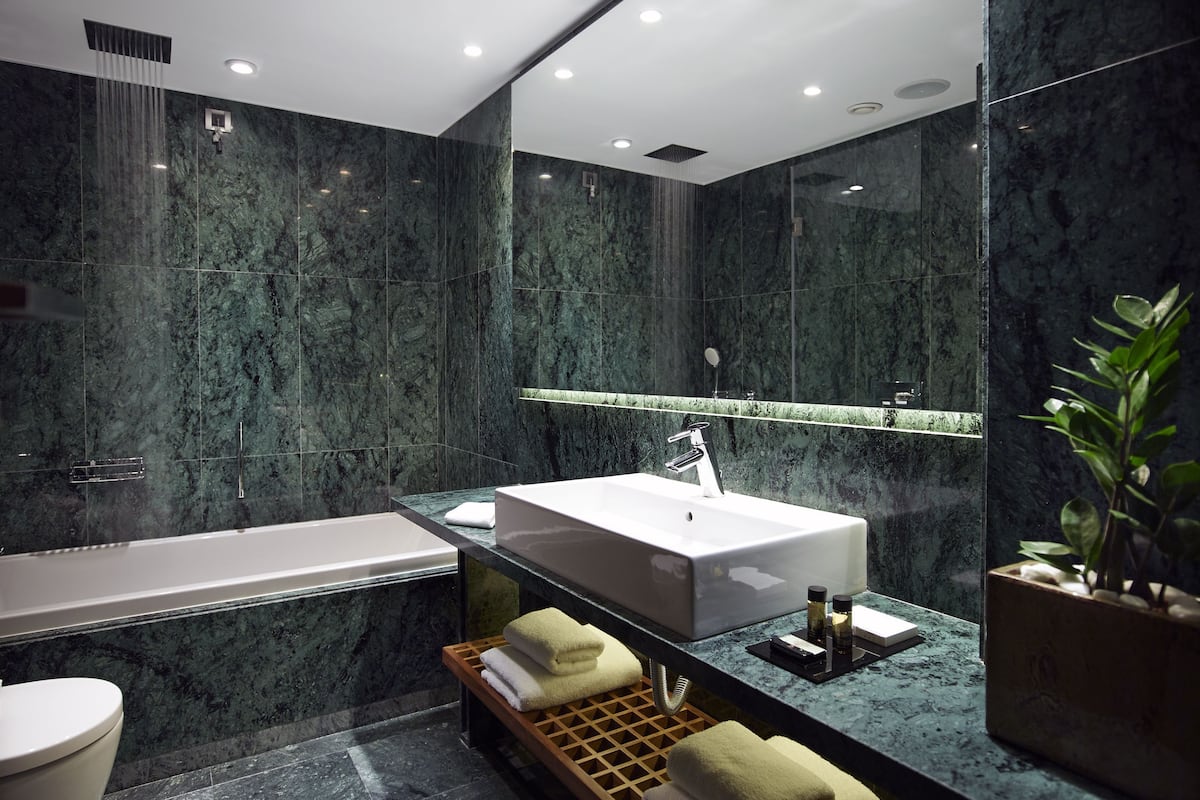 premium room | bathroom | rainfall showerhead, free toiletries, hair dryer, slippers