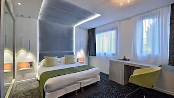 Superior Room | Minibar, in-room safe, individually decorated, individually furnished