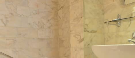 A bathroom with a bathtub, a sink, and a toilet.