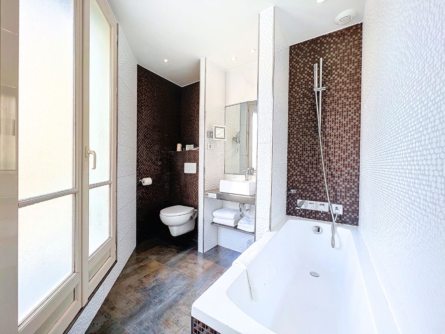 combined shower/bathtub, designer toiletries, hair dryer, slippers