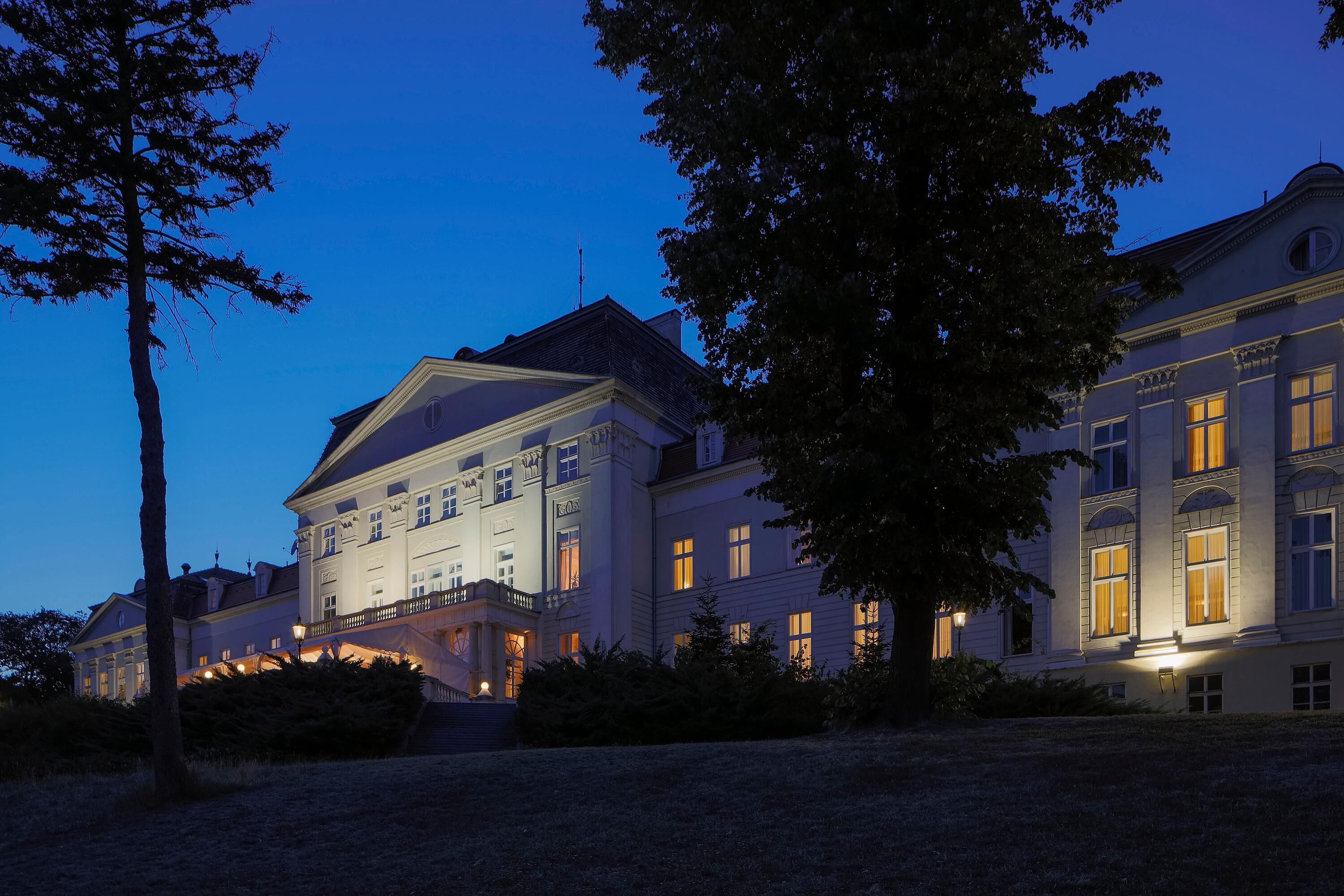 A large, historic building with multiple windows and a prominent entrance.