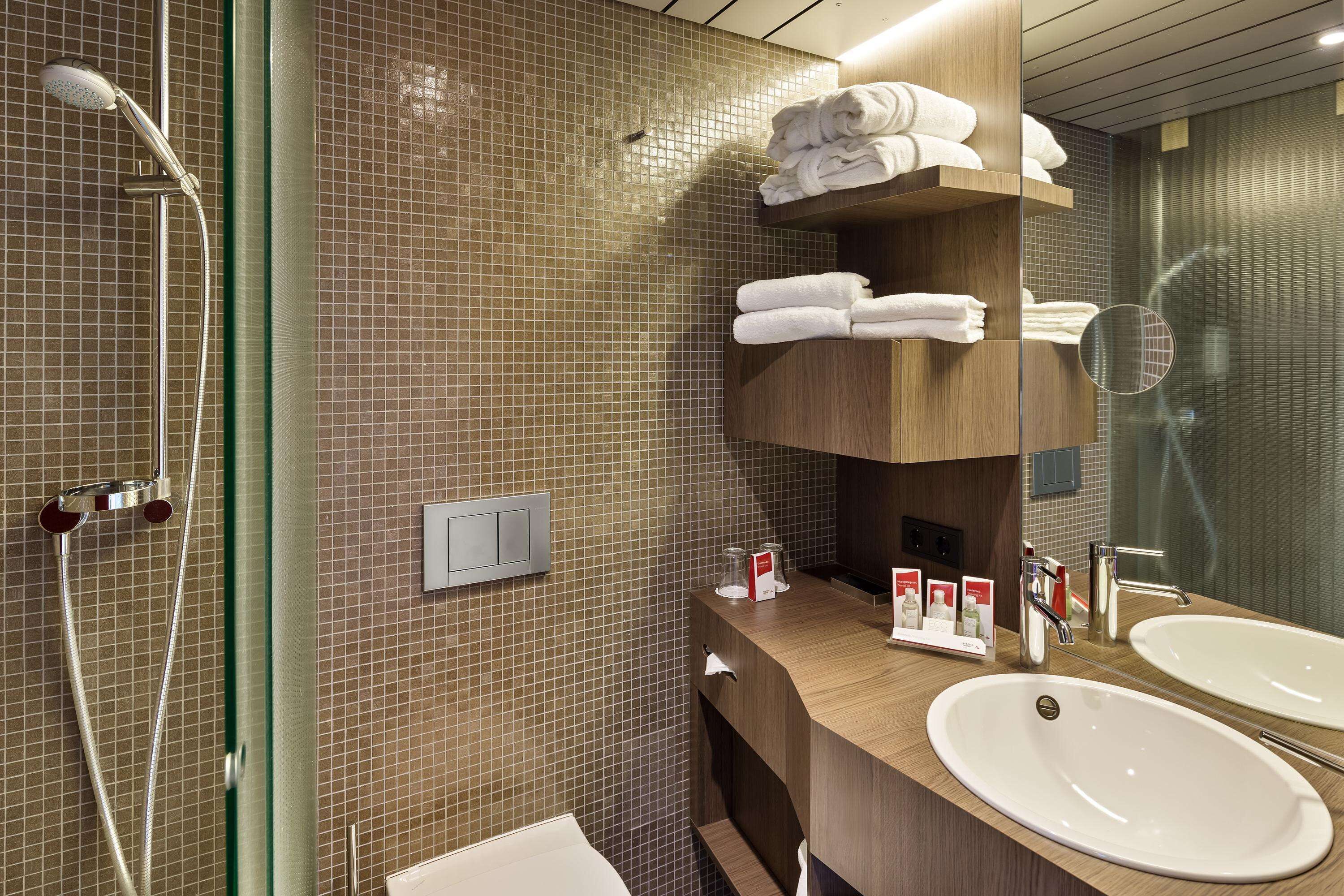 premium room | bathroom | shower, hair dryer, towels