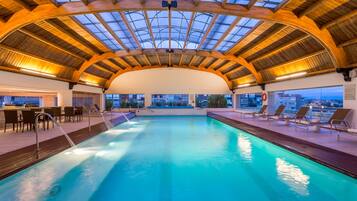 Indoor pool, open 9:00 AM to 6:00 PM, pool loungers