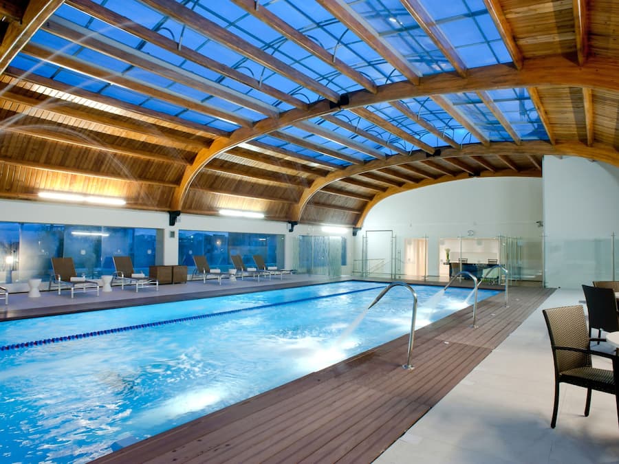 Indoor pool, open 9:00 AM to 6:00 PM, pool loungers