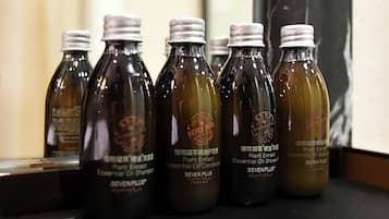 A row of bottles labeled 'SEVEN PLUS' on a shelf.