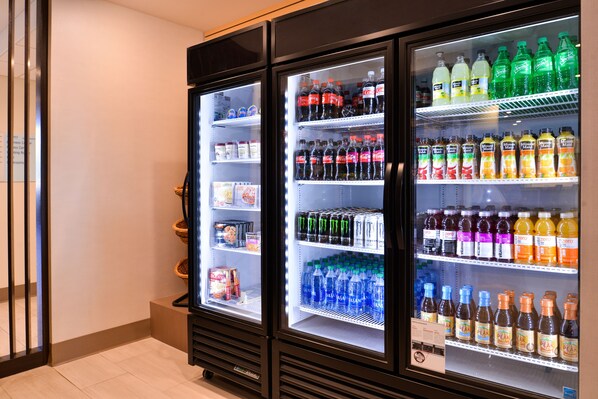 A vending machine with various beverages and snacks.