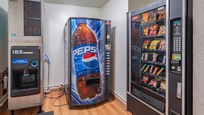 A vending machine with a Pepsi advertisement, an ice dispenser, and a snack vending machine. - Motel 6 Drums, PA (Drums)