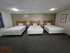 Family Triple Room | Desk, laptop workspace, iron/ironing board, bed sheets