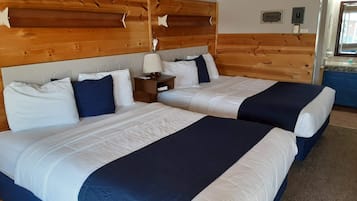 Habitación estándar doble, 2 camas de matrimonio | 1 dormitorio y ropa de cama de alta calidad