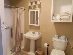 Suite, 2 Queen Beds | Bathroom | Combined shower/bathtub, designer toiletries, towels, soap