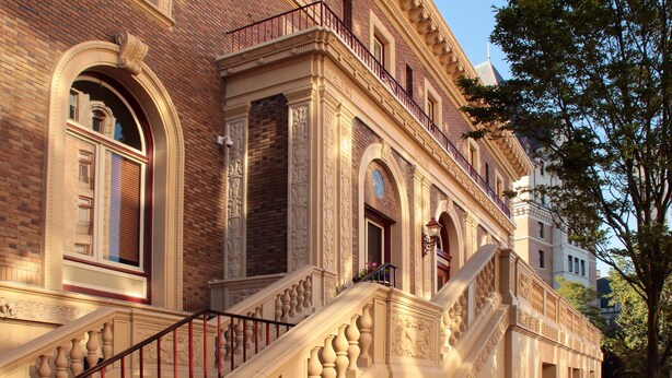 A grand building with a prominent staircase, large windows, and detailed architectural carvings. - The Union Club of British Columbia (Victoria)