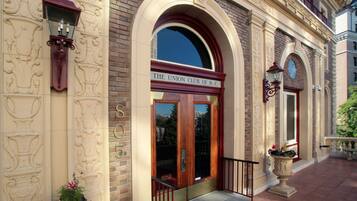 A building with a sign reading "The Union Club of B.C." and a large arched entrance.