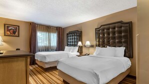 A hotel room with two beds, a desk, and a large window with curtains. - Best Western Marquis Inn & Suites (Prince Albert)