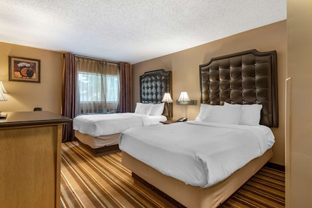 In-room safe, desk, laptop workspace, blackout drapes. Best Western Marquis Inn & Suites