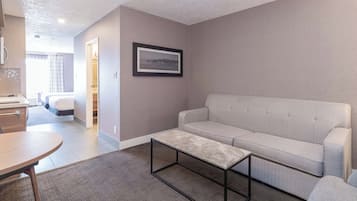 Standard Suite, 2 Double Beds, Sofa Bed, Kitchenette | Living area | 32-inch flat-screen TV with cable channels, TV