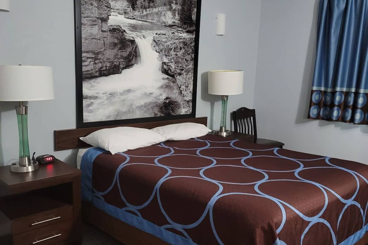 Desk, laptop workspace, blackout drapes, iron/ironing board