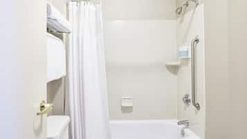 A modern bathroom with a shower, toilet, and a grab bar.
