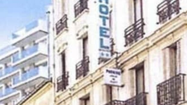A hotel with multiple floors, balconies, and a sign indicating it is a hotel. - Hôtel Avenir Vaugirard (Paris)