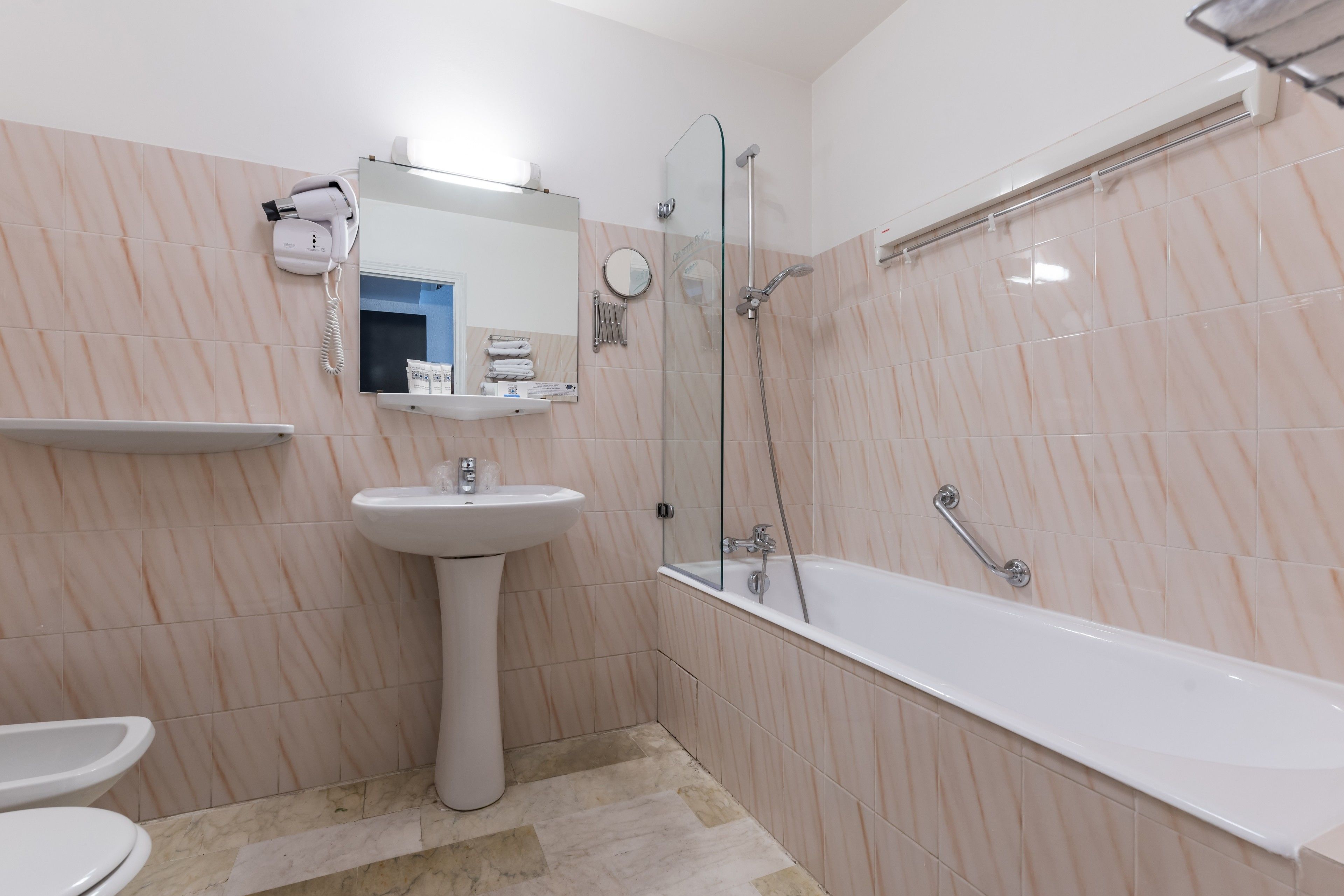 hair dryer, bidet, towels