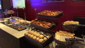 A buffet with various food items including pastries, bread, and rolls. - Relais St Eloi, Sure Hotel Collection by Best Western (Tours)