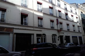 A multi-story building with balconies and windows labeled "Hotel" and "Cardinal." - Hôtel Cardinal Rive Gauche (Paris)