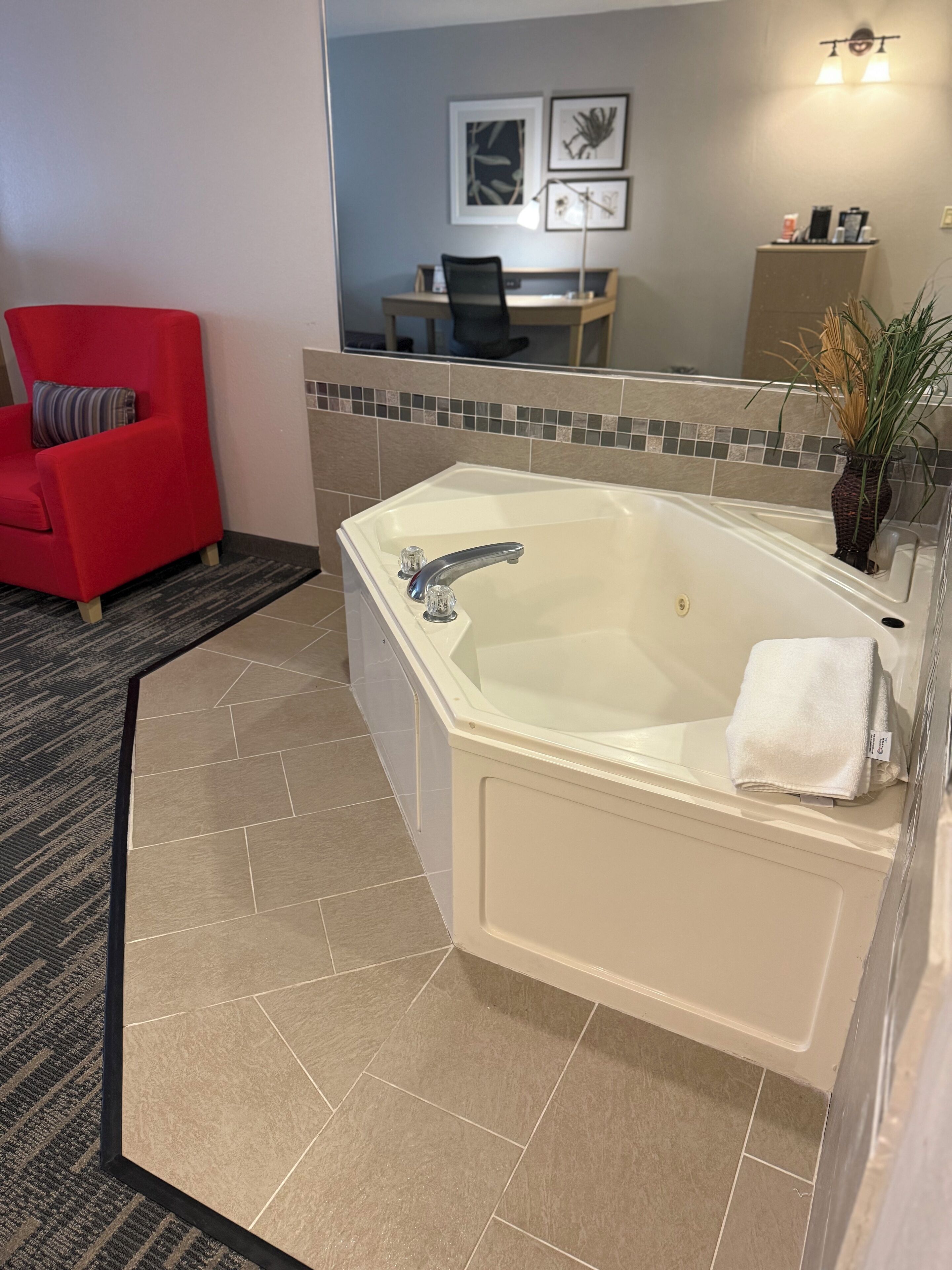 suite, 1 king bed, non smoking, jetted tub | 1 bedroom, desk, blackout curtains, iron/ironing board