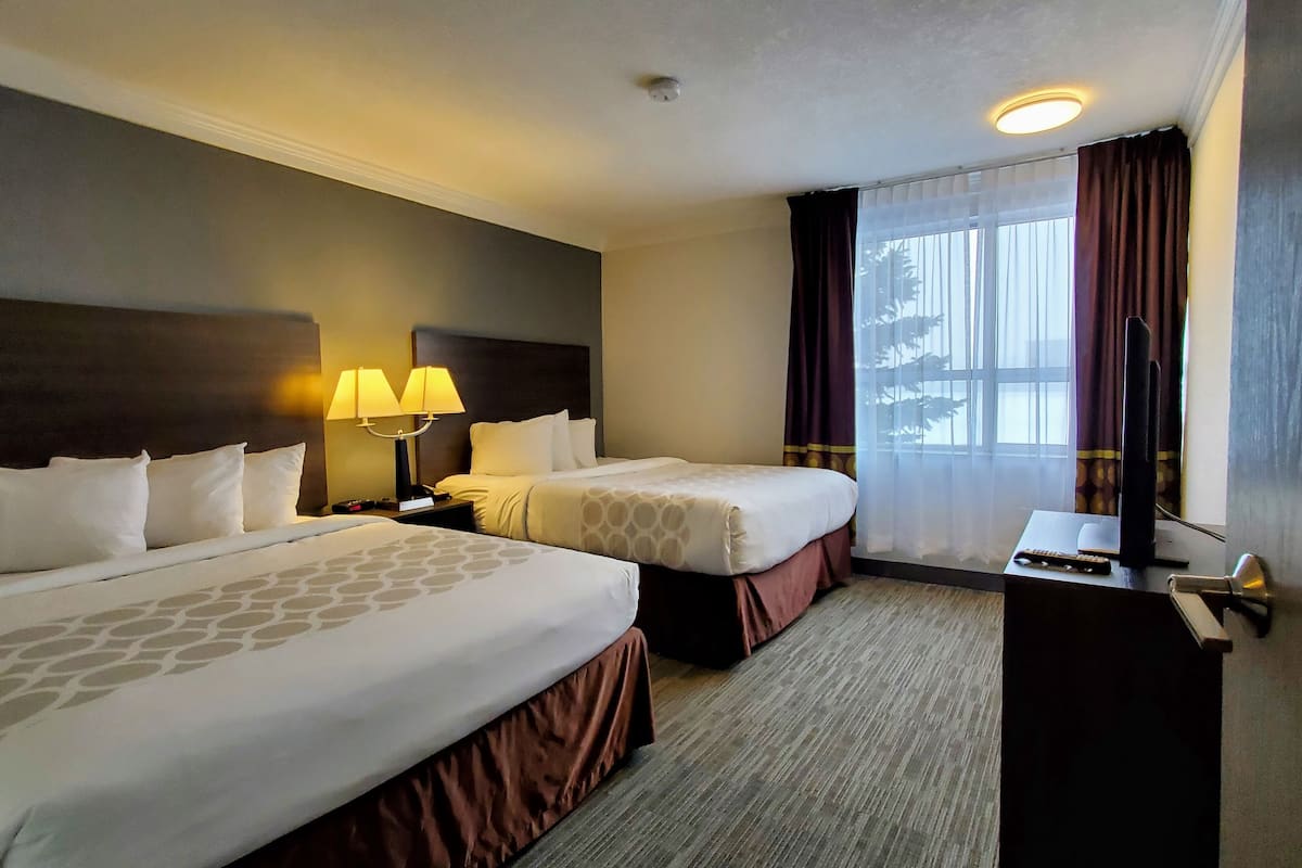Suite, 2 Queen Beds, Non Smoking, Kitchenette (Pacific) | Desk, iron/ironing board, free cribs/infant beds, rollaway beds