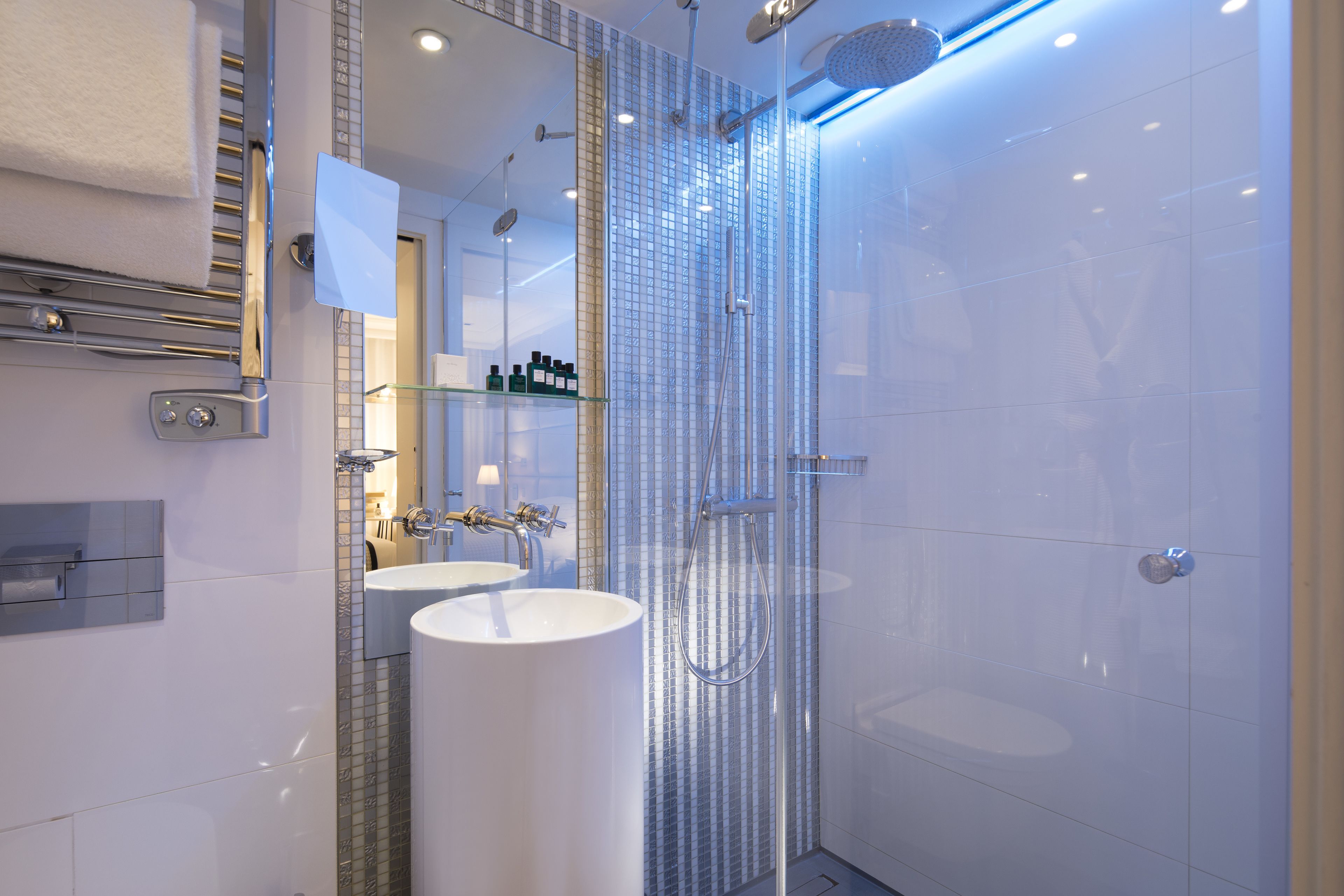 designer toiletries, hair dryer, bathrobes, slippers