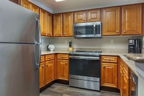 Microwave, coffee/tea maker, toaster, cookware/dishes/utensils