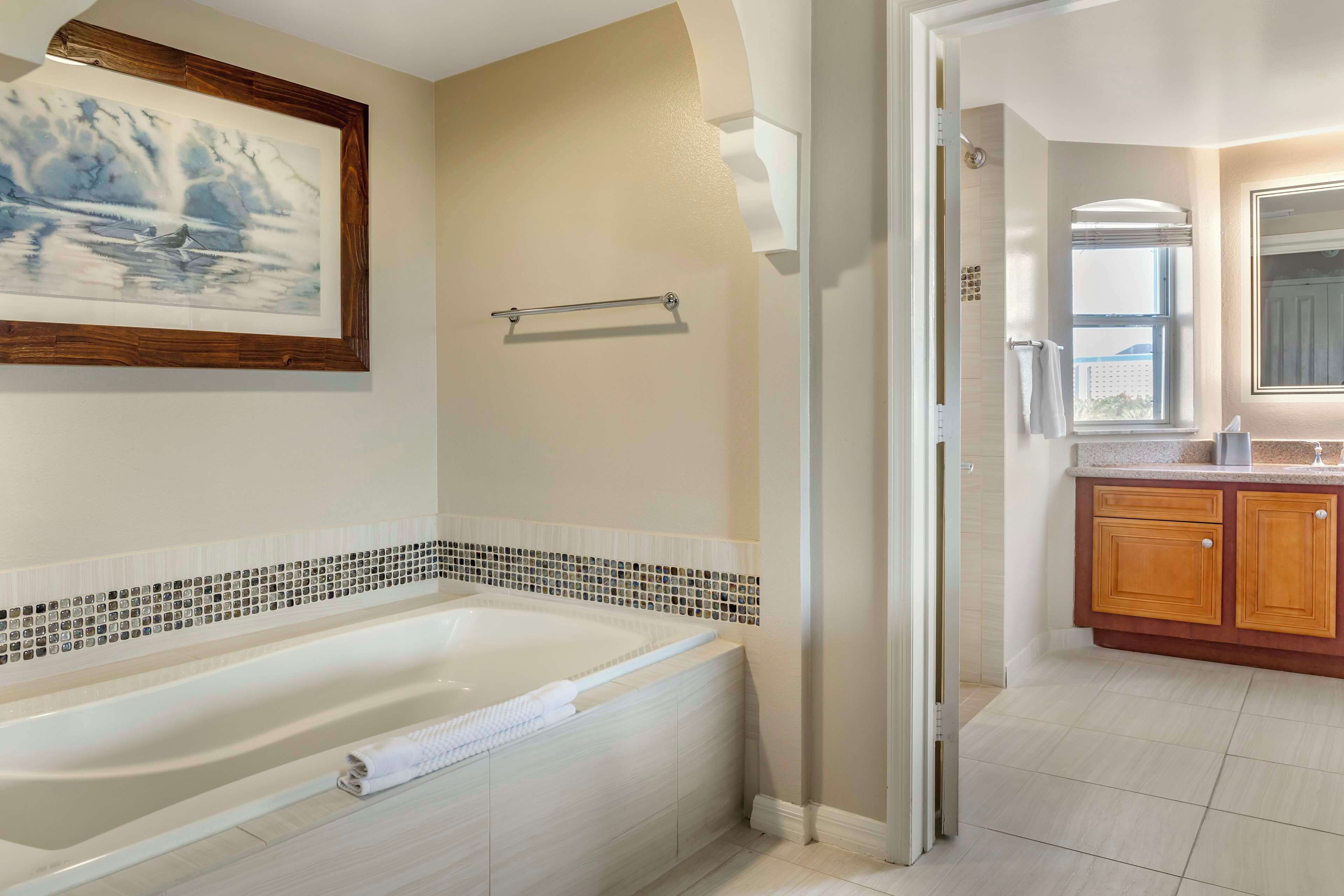 designer toiletries, hair dryer, towels