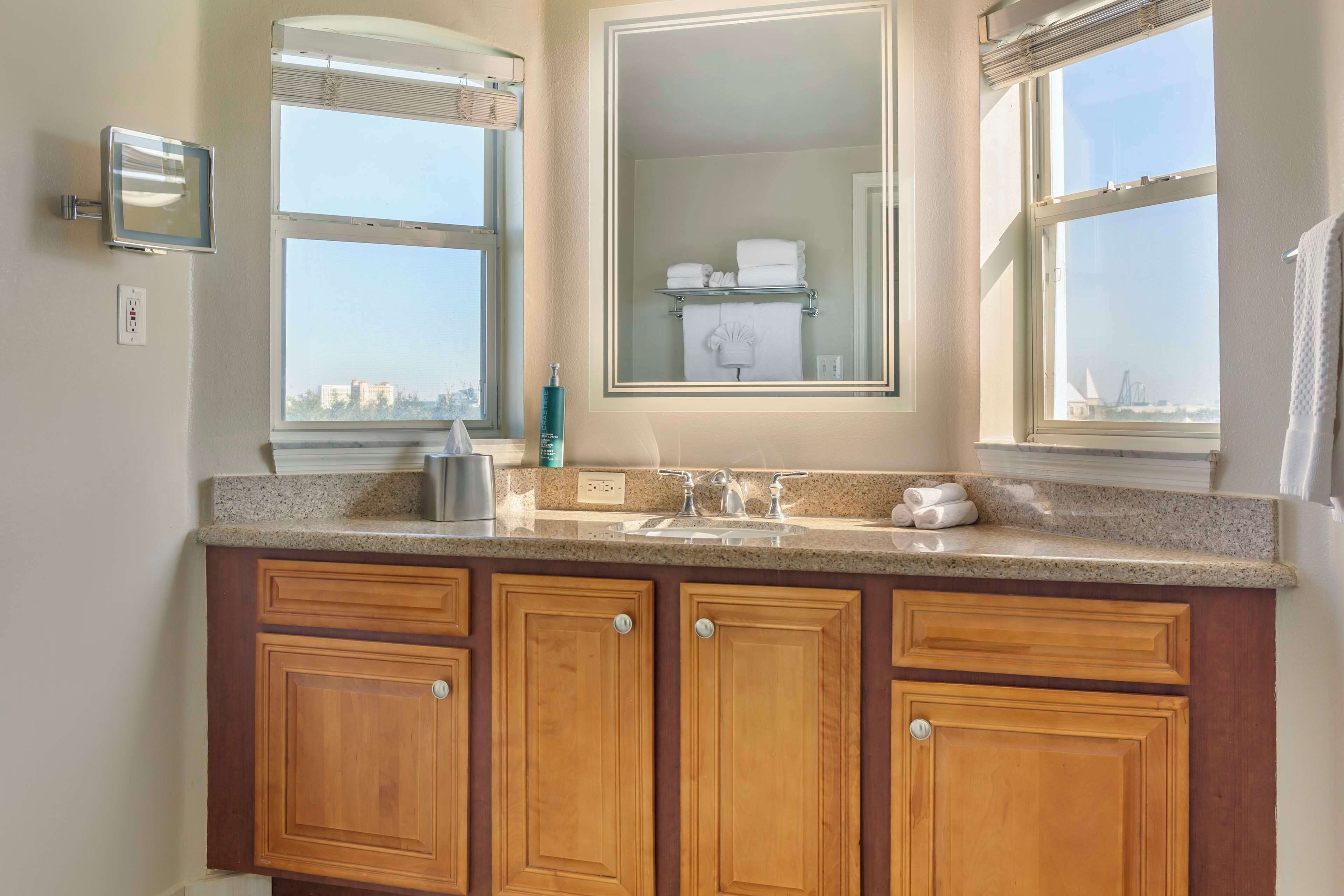 designer toiletries, hair dryer, towels