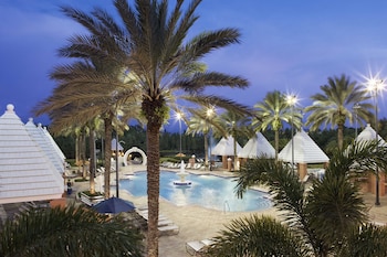 3 outdoor pools, pool umbrellas, sun loungers at Hilton Grand Vacations Club SeaWorld® Orlando