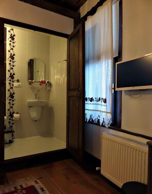 Shower, free toiletries, hair dryer, slippers