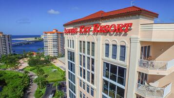 A hotel named 'Lovers Key Resort' with a view of the ocean and a bridge in the background.