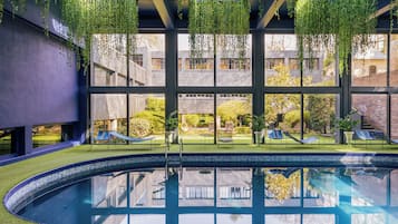 Indoor pool, open 7:00 AM to 10:00 PM, pool umbrellas, pool loungers
