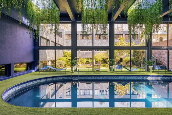Indoor pool, open 7:00 AM to 10:00 PM, pool umbrellas, pool loungers