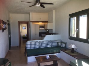 Apartment, 1 Bedroom, Sea View | Living room | Flat-screen TV