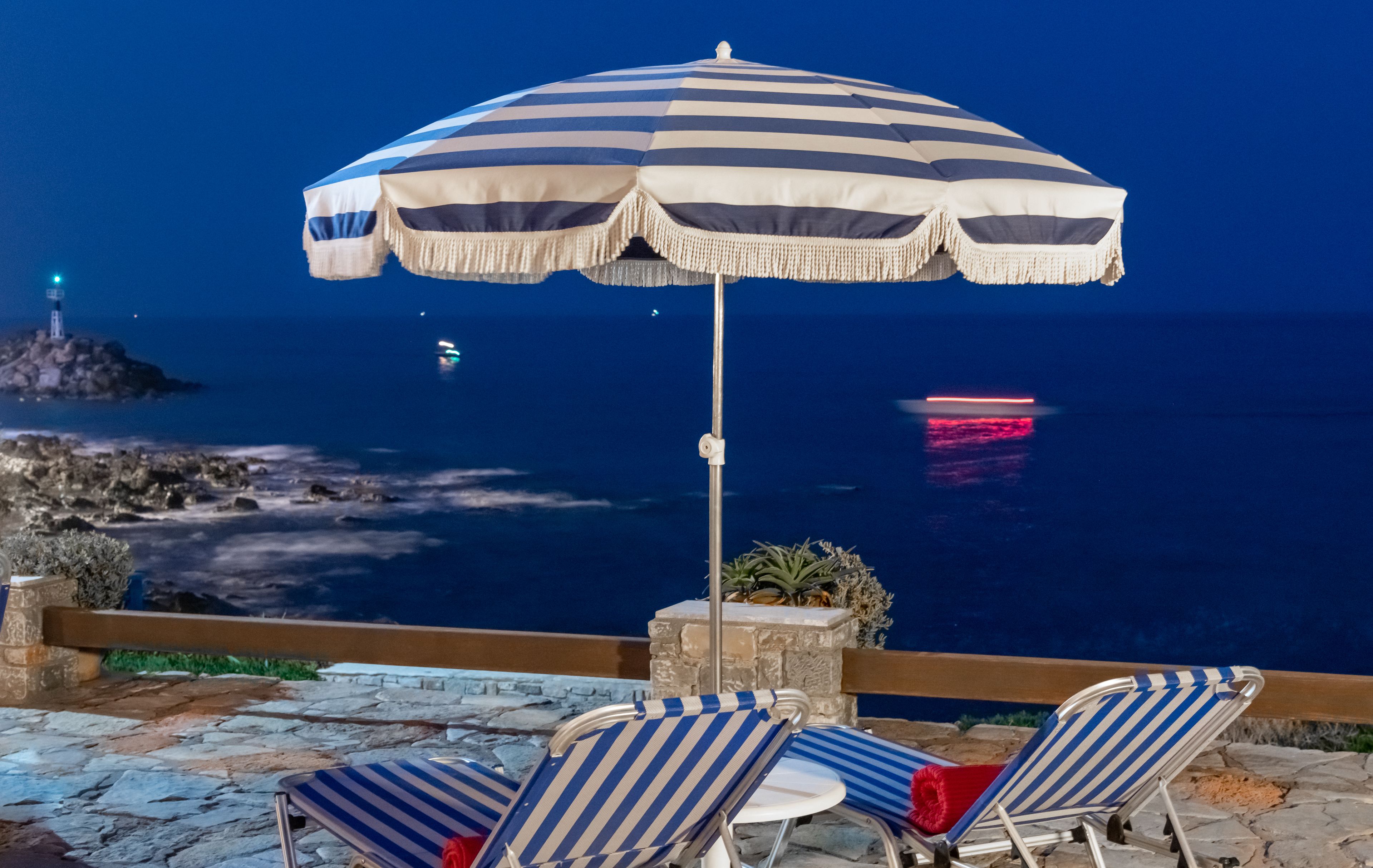 Seasonal outdoor pool, open 9:30 AM to 6:00 PM, pool umbrellas