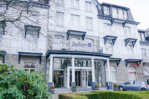 A Radisson BLU Balmoral Hotel with a grand entrance, large windows, and a stone facade. - Radisson Blu Balmoral Hotel, Spa (Spa)