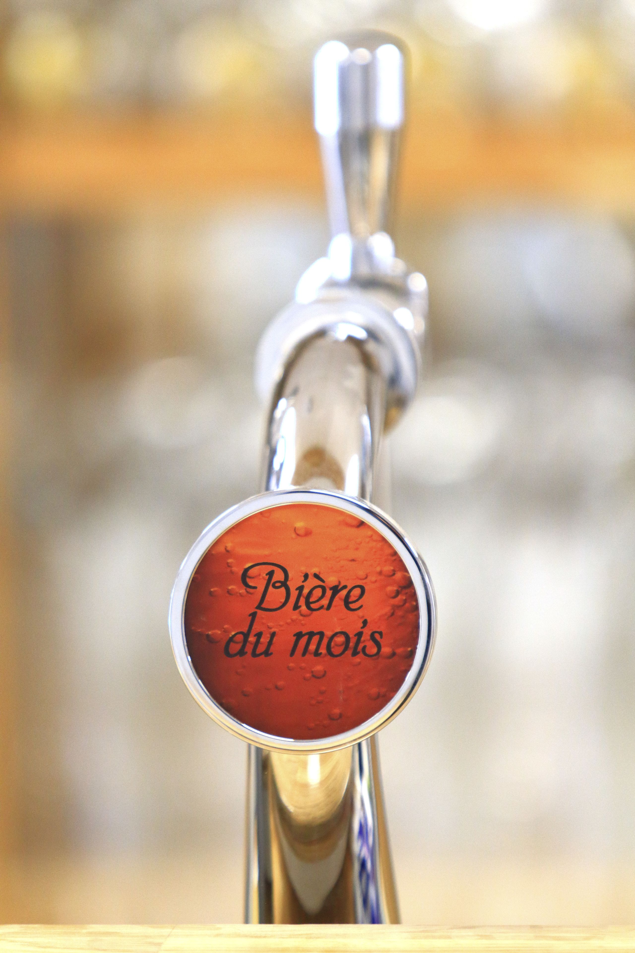 Hanetapk med skilt, der siger "Bière du mois".
