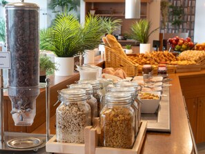 A buffet with various food items and a coffee dispenser. - ibis Paris 17 Clichy-Batignolles (Paris)