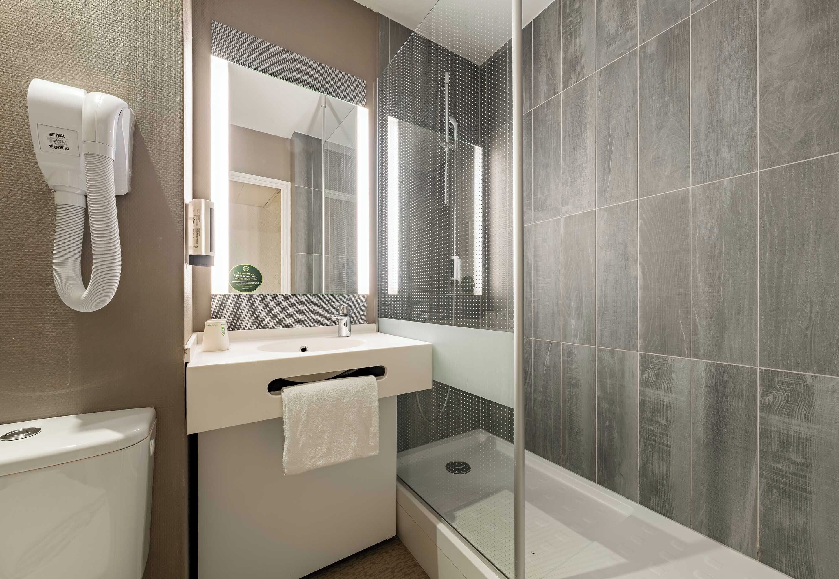 shower, eco-friendly toiletries, hair dryer, towels