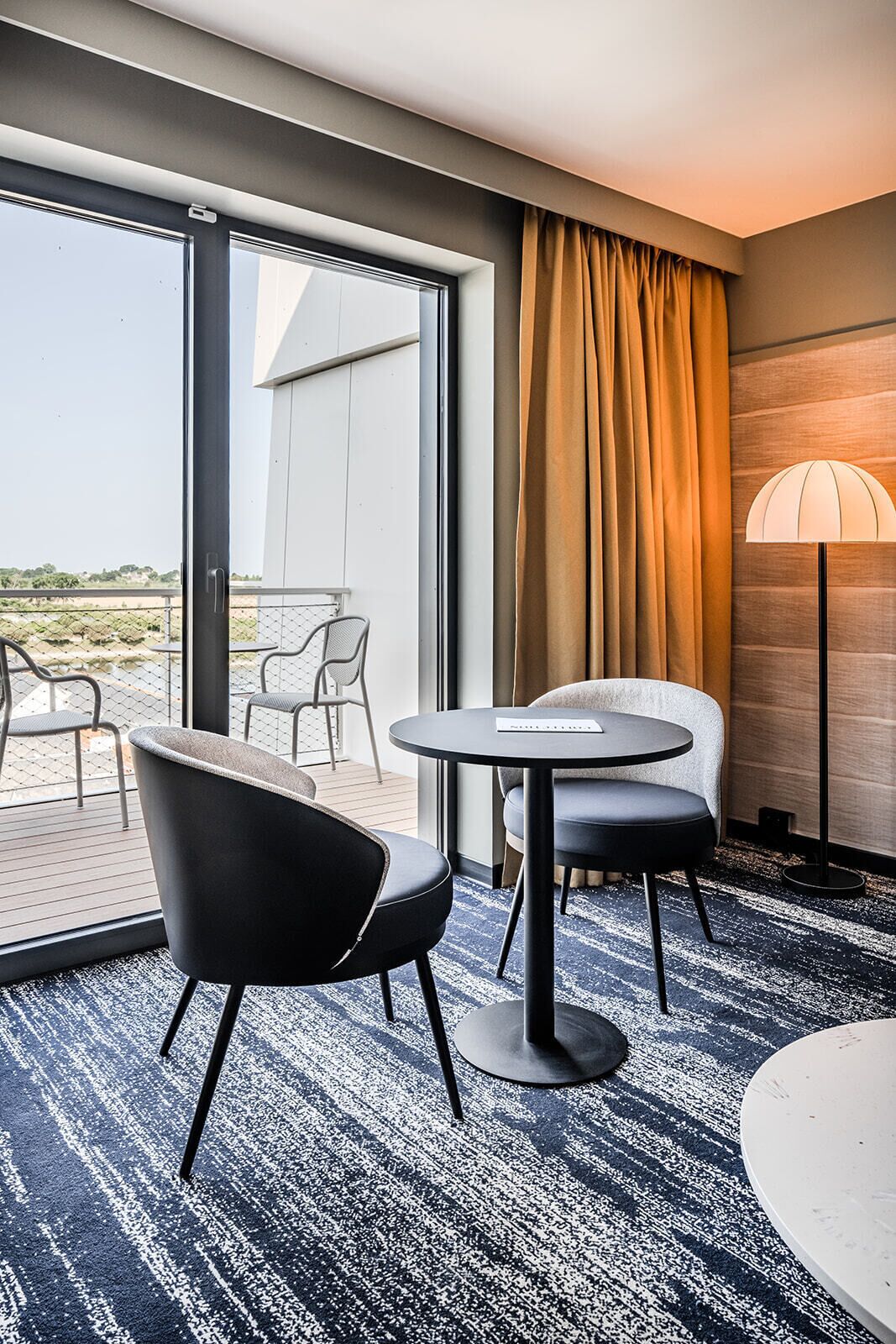 suite | living area | flat-screen tv