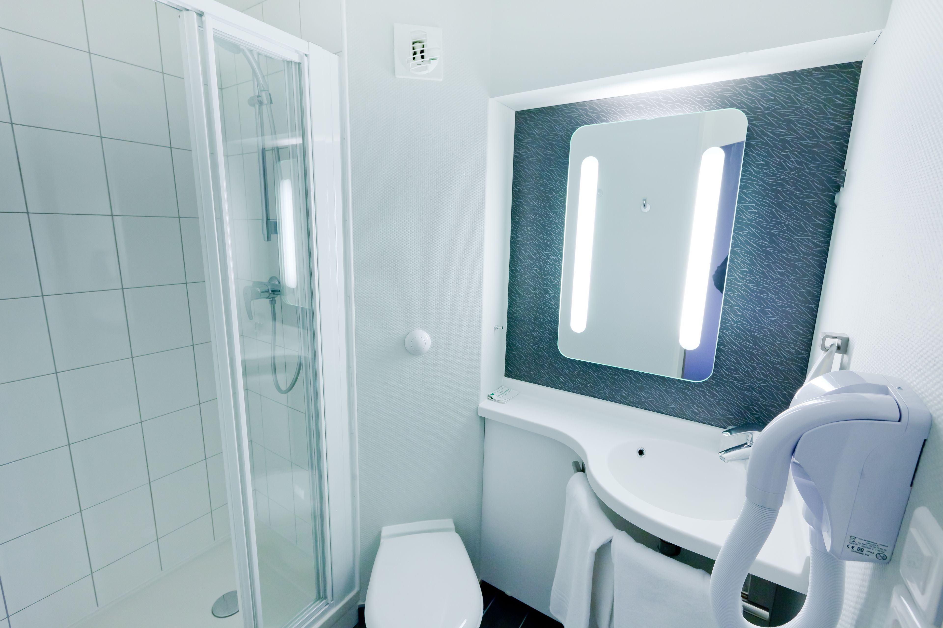 shower, eco-friendly toiletries, hair dryer, towels