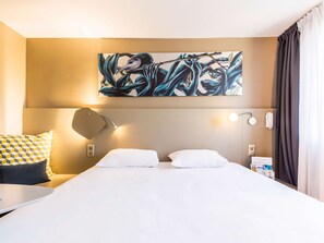 Premium bedding, blackout curtains, soundproofing, iron/ironing board