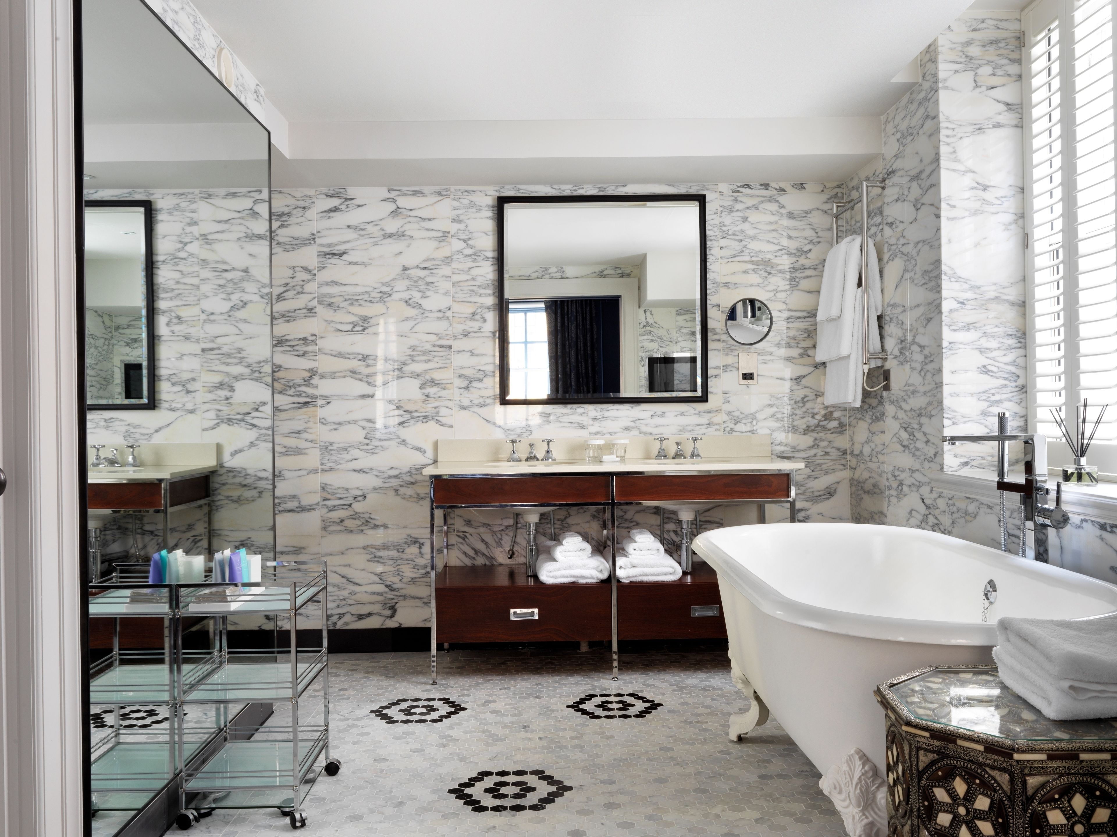 combined shower/bathtub, designer toiletries, hair dryer, slippers